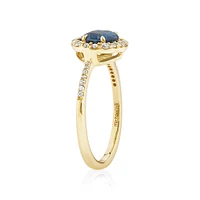 Halo Ring with London Blue Topaz & 0.25 Carat TW of Diamonds in 10kt Yellow Gold