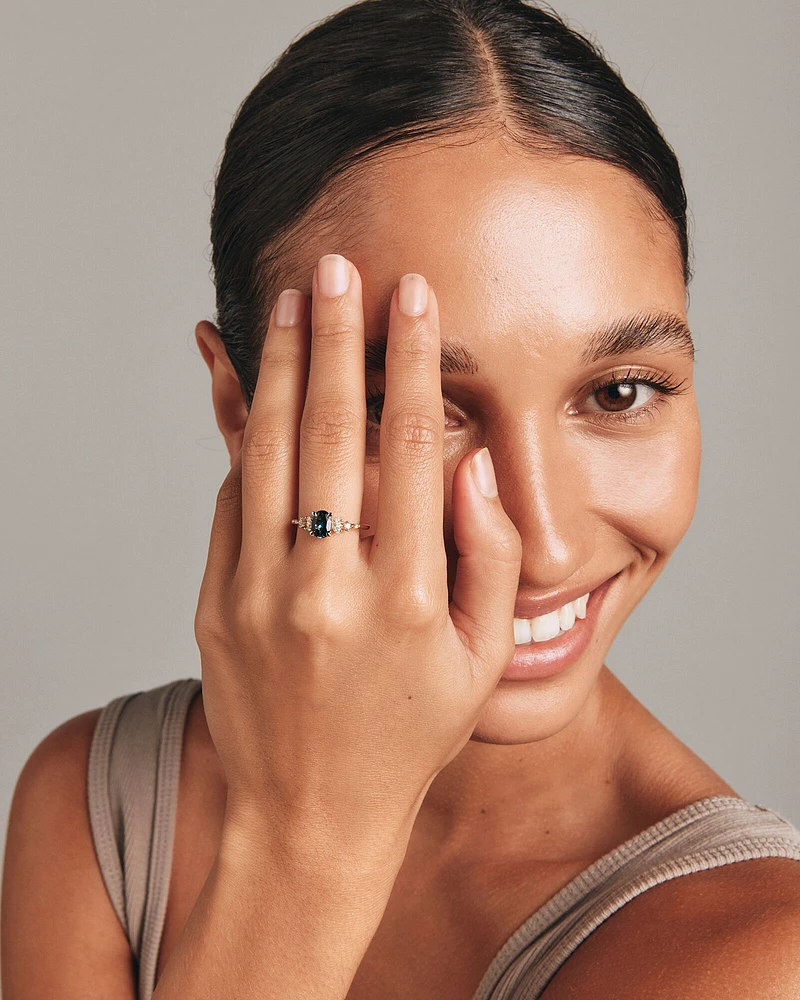 Ring with Blue Topaz and 0.12 Carat TW of Diamonds in 10kt Yellow Gold