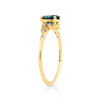 Ring with Blue Topaz and 0.12 Carat TW of Diamonds 10kt Yellow Gold