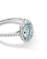 Halo Ring with Aquamarine & 0.29 Carat TW of Diamonds in 10kt White Gold