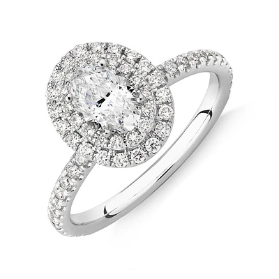 Oval Halo Ring with 0.90 Carat TW of Diamonds in 18kt White Gold