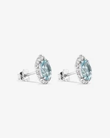 Oval Cut Blue Aquamarine Gemstone and 0.27 Carat TW Diamond Halo Stud Earrings in 10kt White Gold