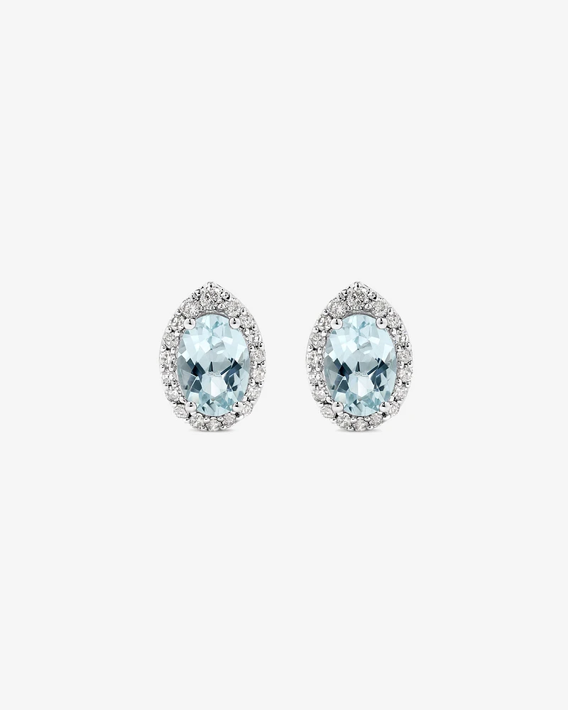 Oval Cut Blue Aquamarine Gemstone and 0.27 Carat TW Diamond Halo Stud Earrings in 10kt White Gold