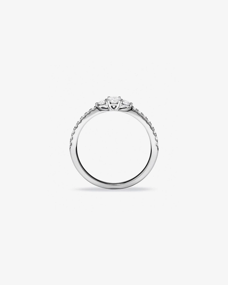 0.40 Carat TW Oval and Round Brilliant Three Stone Side Accent Engagement Ring in 14kt White Gold