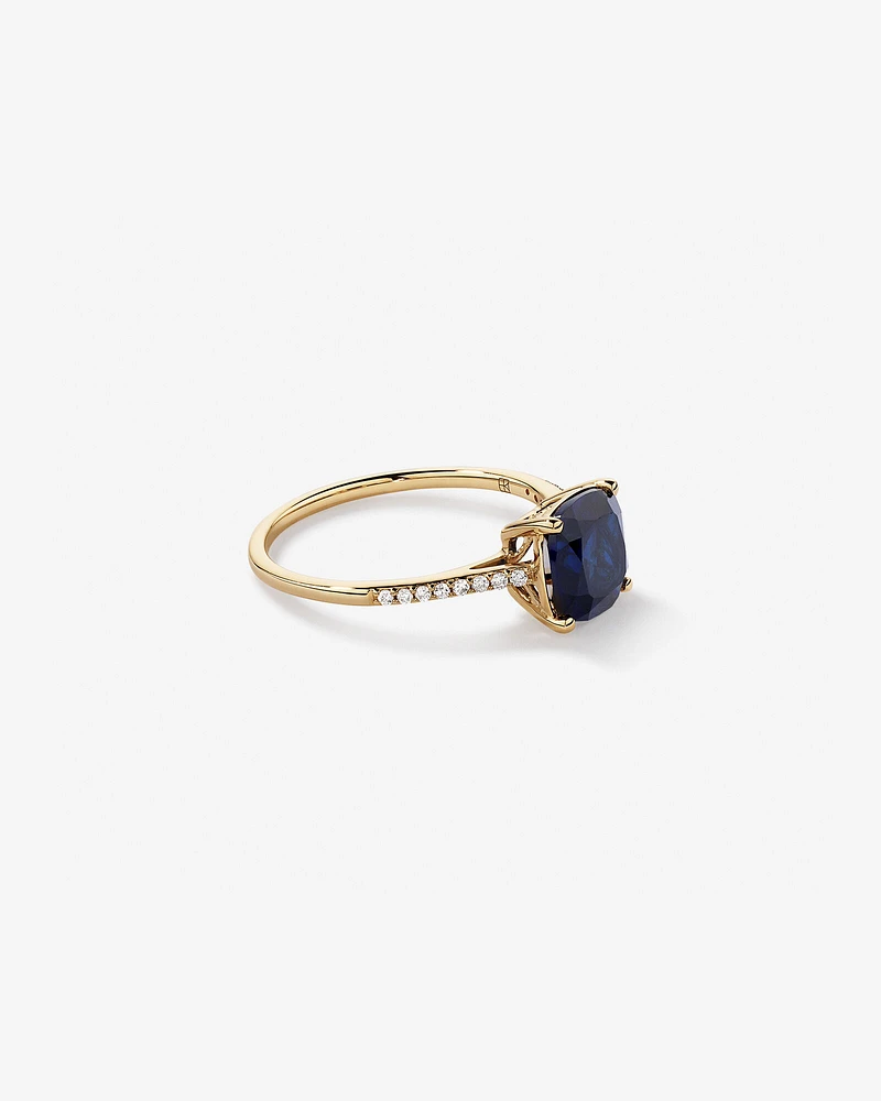 Cushion Cut Blue Created Sapphire Gemstone and Diamond Ring in 10kt Yellow Gold