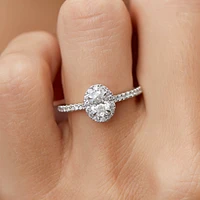 Halo Oval Engagement Ring with 0.92 Carat TW of Diamonds in 14kt White Gold