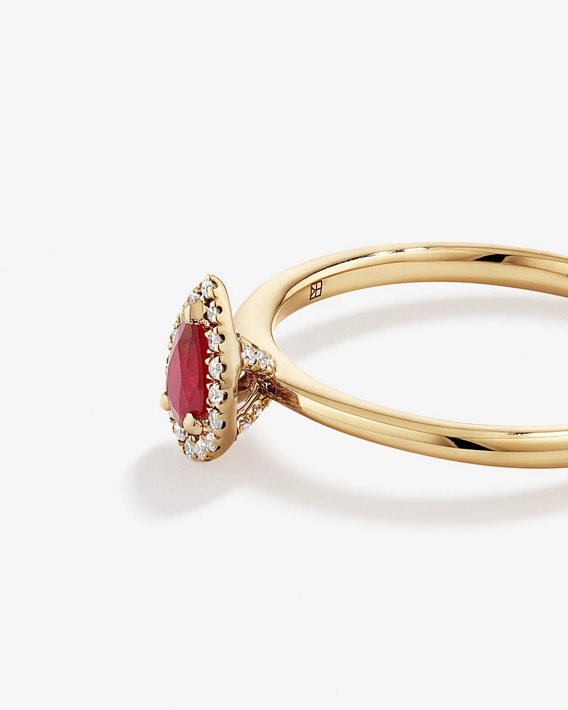 Pear Cut Red Ruby Gemstone and 0.08 Carat TW Diamond Halo Ring in 10kt Yellow Gold