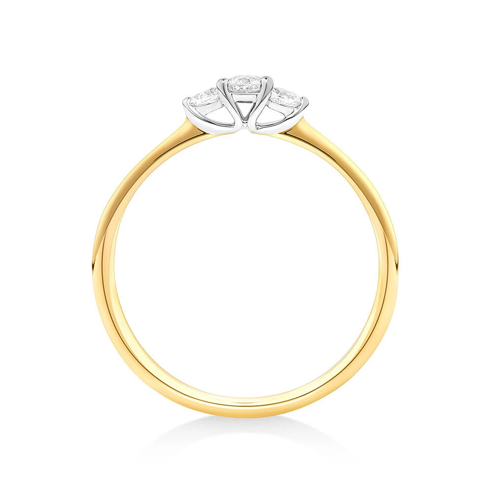 0.15 Carat TW Three Stone Round Brilliant and Oval Cut Diamond Promise Ring in 10kt Yellow and White Gold