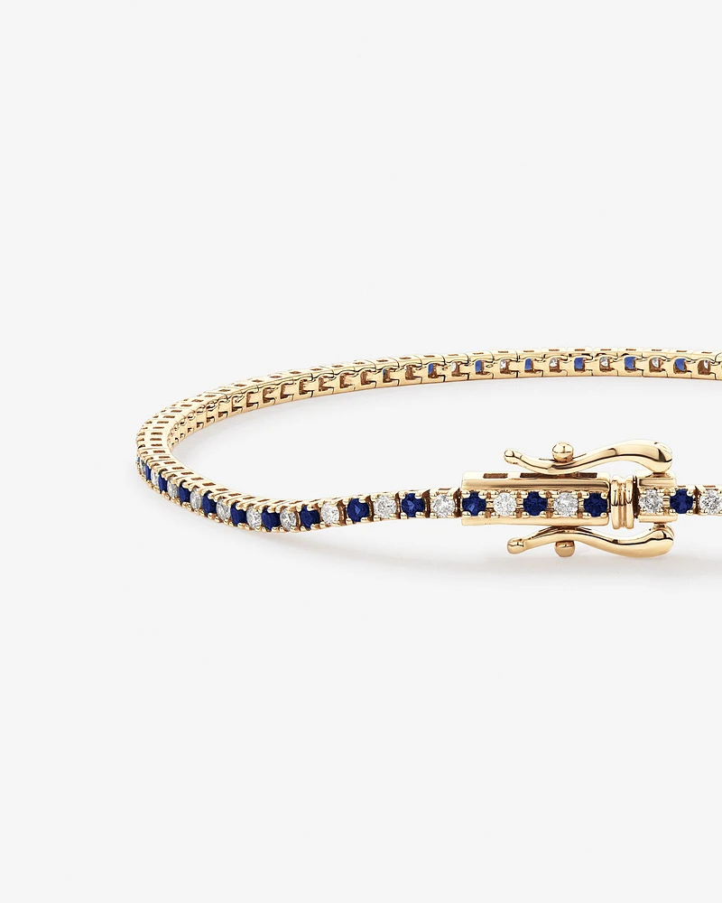 0.68 Carat TW Diamond and Created Sapphire Tennis Bracelet in 10kt Yellow Gold