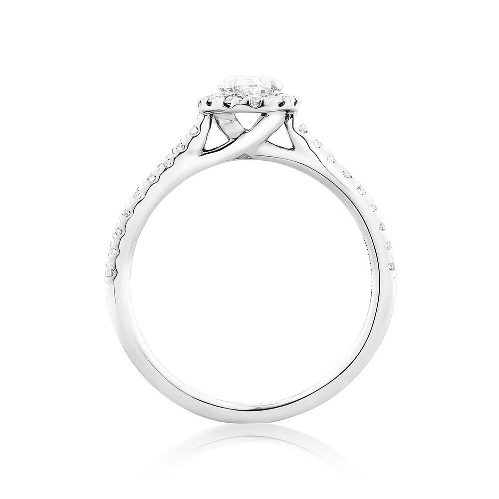 Halo Oval Engagement Ring with 0.92 Carat TW of Diamonds in 14kt White Gold