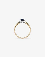 Oval Cut Blue Sapphire Gemstone and 0.10 Carat TW Diamond Halo Engagement Ring in 10kt Yellow and White Gold