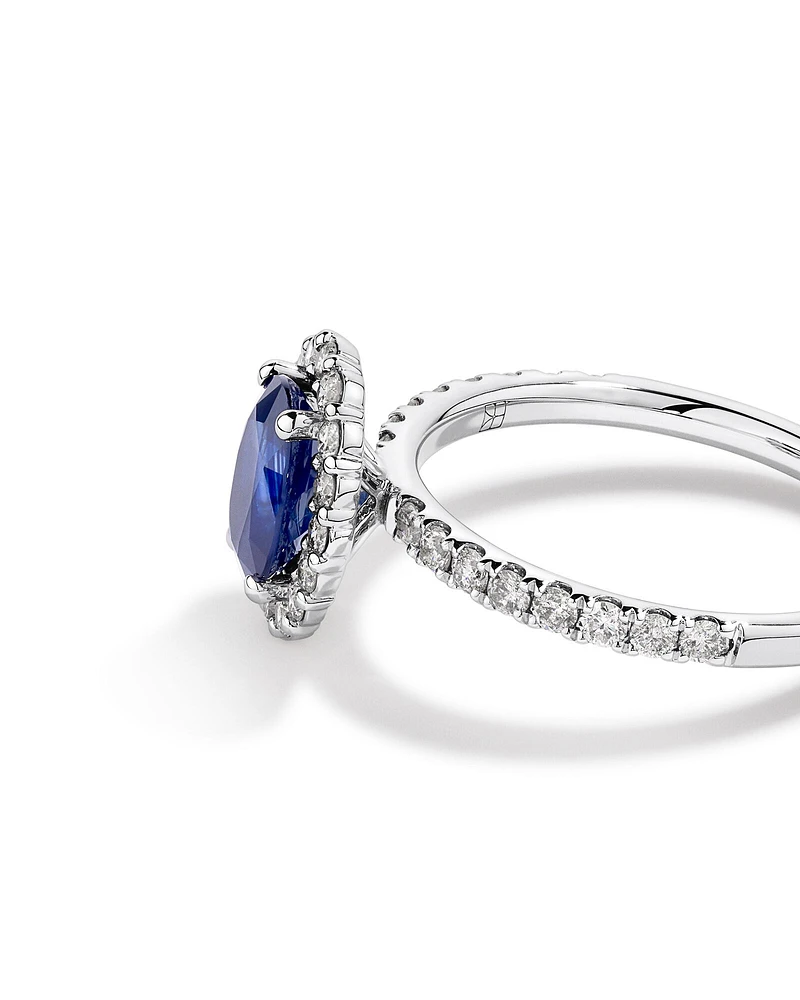 Oval Cut Blue Sapphire Gemstone and 0.60 Carat TW Diamond Halo Ring in 14kt White Gold