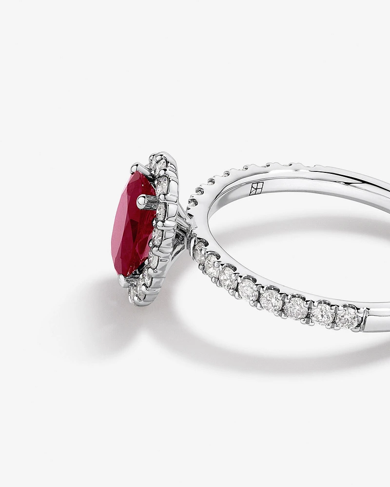 Oval Cut Red Ruby Gemstone and 0.60 Carat TW Diamond Halo Ring in 14kt White Gold