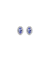 Oval Cut Blue Tanzanite Gemstone and 0.12 Carat TW Diamond Halo Stud Earrings in 10kt White Gold