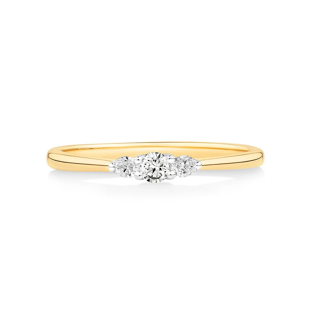 0.15 Carat TW Three Stone Round Brilliant and Oval Cut Diamond Promise Ring in 10kt Yellow and White Gold