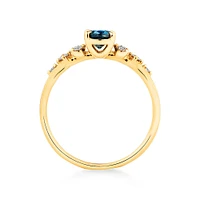 Ring with Blue Topaz and 0.12 Carat TW of Diamonds in 10kt Yellow Gold