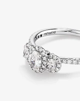 0.77 Carat TW Three Stone Oval Cut Halo Engagement Ring in 14kt White Gold