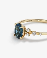 Ring with Blue Topaz and 0.12 Carat TW of Diamonds 10kt Yellow Gold