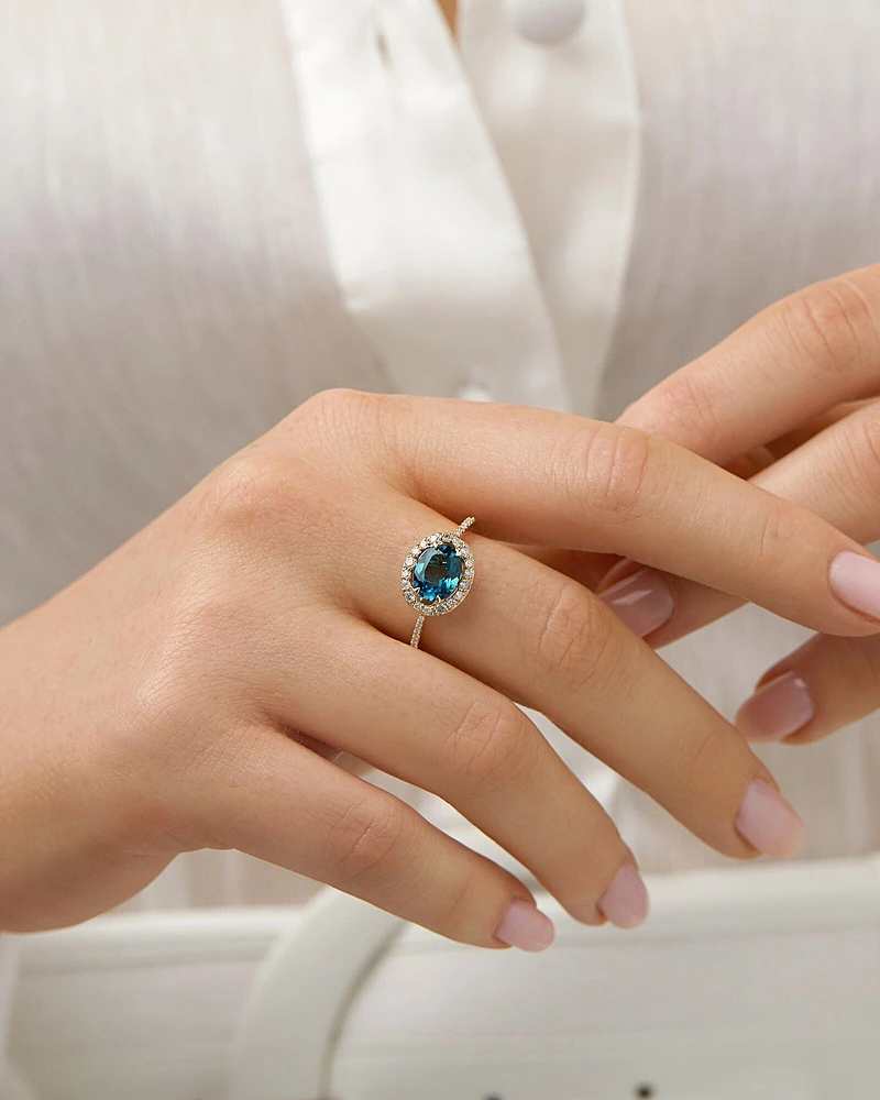 Halo Ring with London Blue Topaz & 0.25 Carat TW of Diamonds in 10kt Yellow Gold