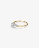 0.69 Carat TW Three Stone Oval and Pear Cut Diamond Halo Engagement Ring in 14kt Yellow and White Gold