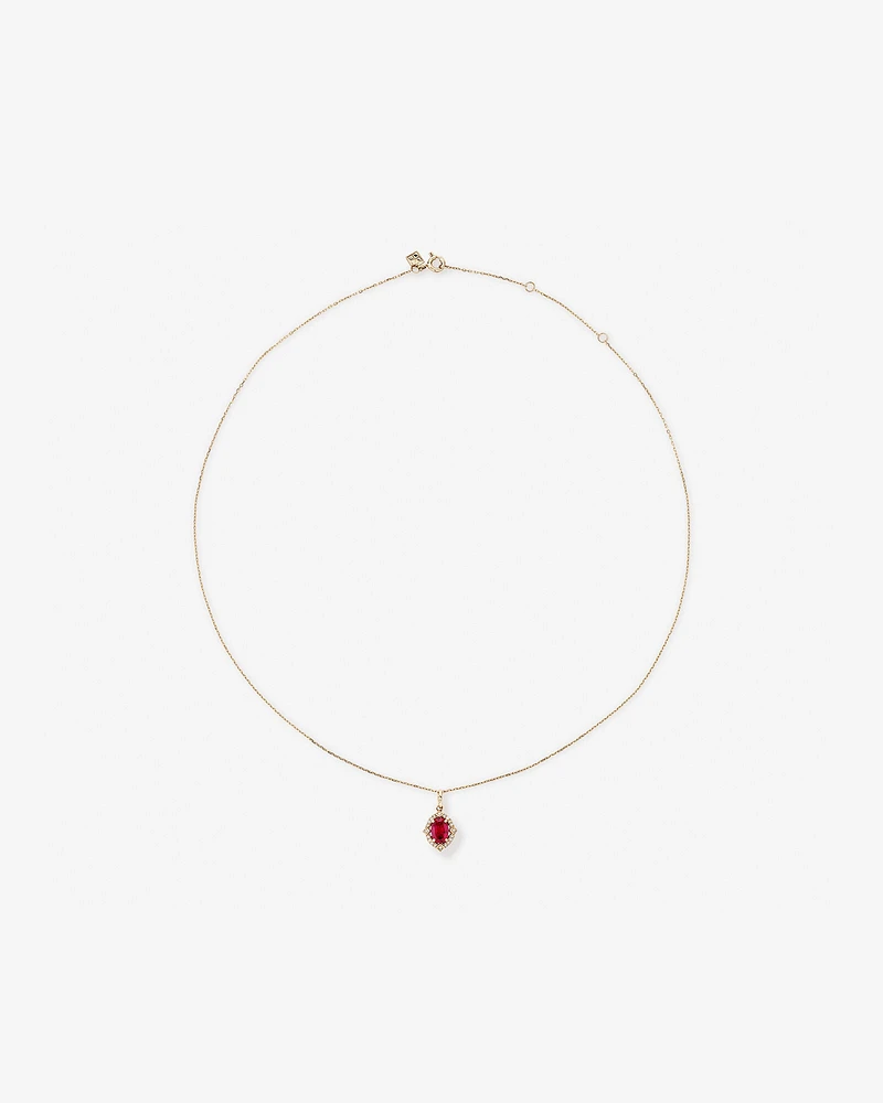 Oval Cut Created Ruby and Diamond Halo Pendant Necklace in 10kt Yellow Gold