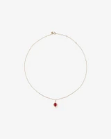 Oval Cut Created Ruby and Diamond Halo Pendant Necklace in 10kt Yellow Gold