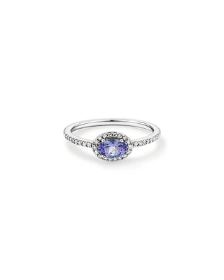 Oval Cut Blue Tanzanite Gemstone and 0.15 Carat TW Diamond Halo East West Ring in 10kt White Gold