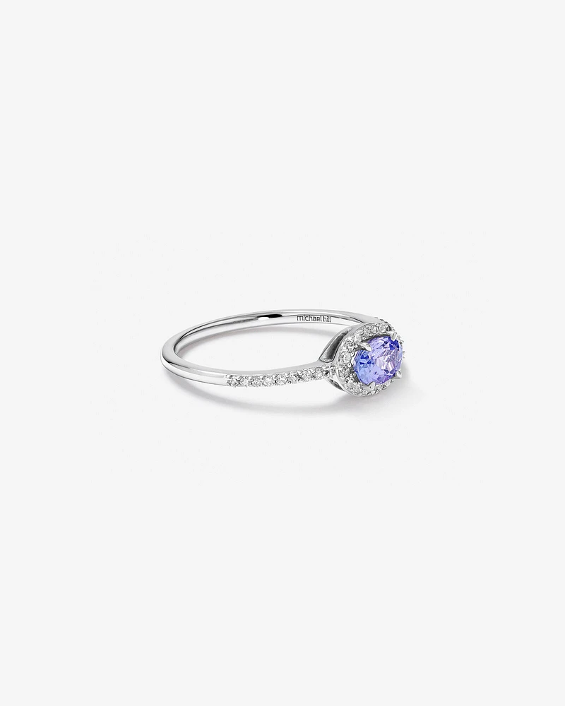 Halo Ring with Tanzanite & 0.15 Carat TW Of Diamonds in 10kt White Gold