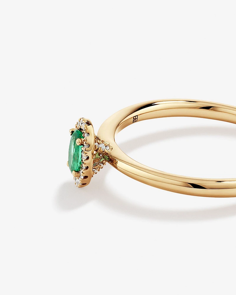 Oval Cut Green Emerald Gemstone and 0.08 Carat TW Diamond Halo Ring in 10kt Yellow Gold