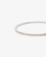 Double twist bangle with .32 Carat TW Diamonds in Sterling Silver and 10kt Yellow Gold