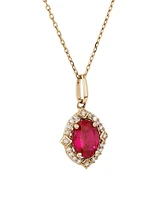 Oval Cut Created Ruby and Diamond Halo Pendant Necklace in 10kt Yellow Gold