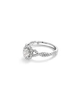 0.75 Carat TW Oval Cut Diamond Twist Side Accent Halo Engagement Ring in 14kt White Gold