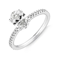 Engagement Ring with 1.14 Carat TW of Diamonds. A 1 Carat Oval Centre Laboratory-Grown Diamond and shouldered by 0.14 Carat TW of Natural Diamonds in 14kt White Gold