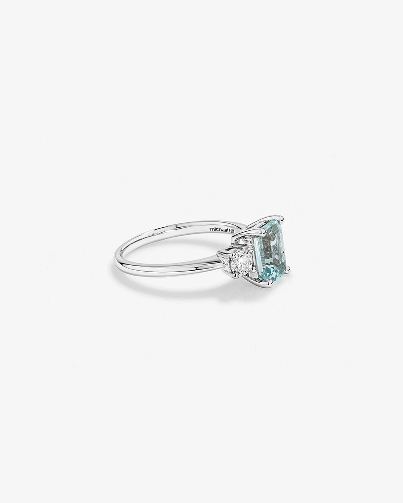 Bague en or blanc 10 K avec aigue-marine et diamants totalisant 0,40 ct