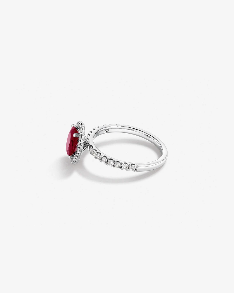 Oval Cut Red Ruby Gemstone and 0.60 Carat TW Diamond Halo Ring in 14kt White Gold