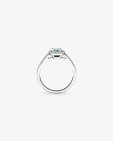 Oval Cut Blue Aquamarine Gemstone and 0.29 Carat TW Diamond Halo Ring in 10kt White Gold