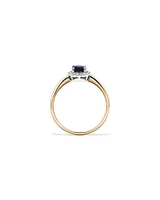 Oval Cut Blue Sapphire Gemstone and 0.10 Carat TW Diamond Halo Engagement Ring in 10kt Yellow and White Gold