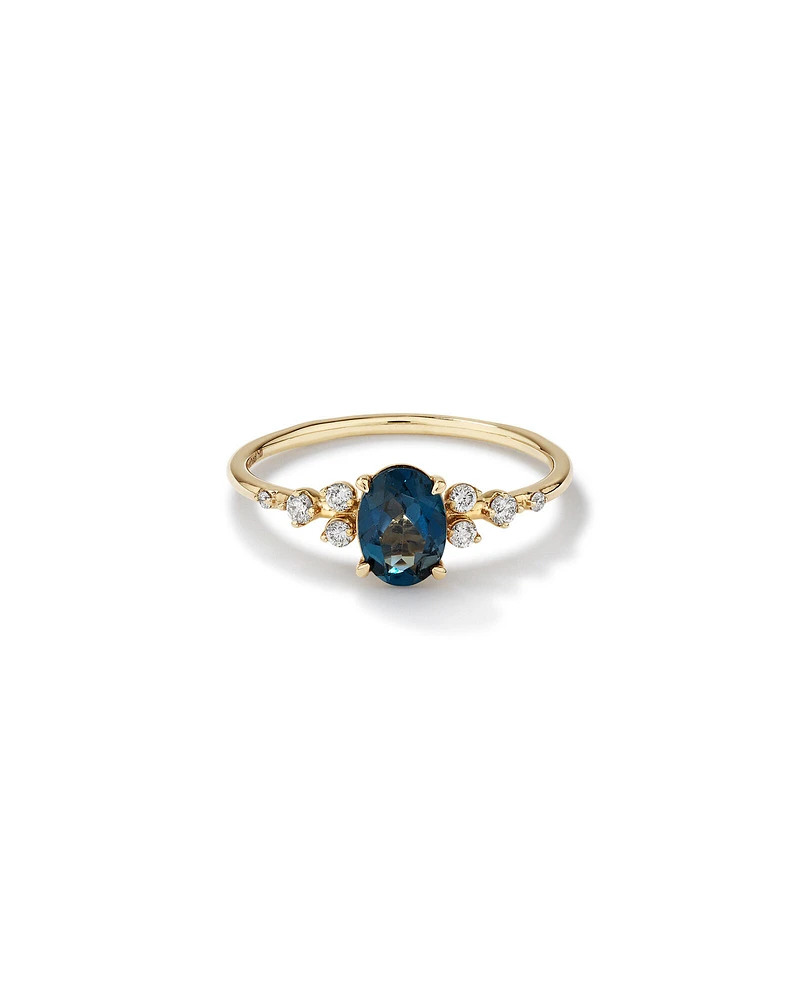 Ring with Blue Topaz and 0.12 Carat TW of Diamonds 10kt Yellow Gold