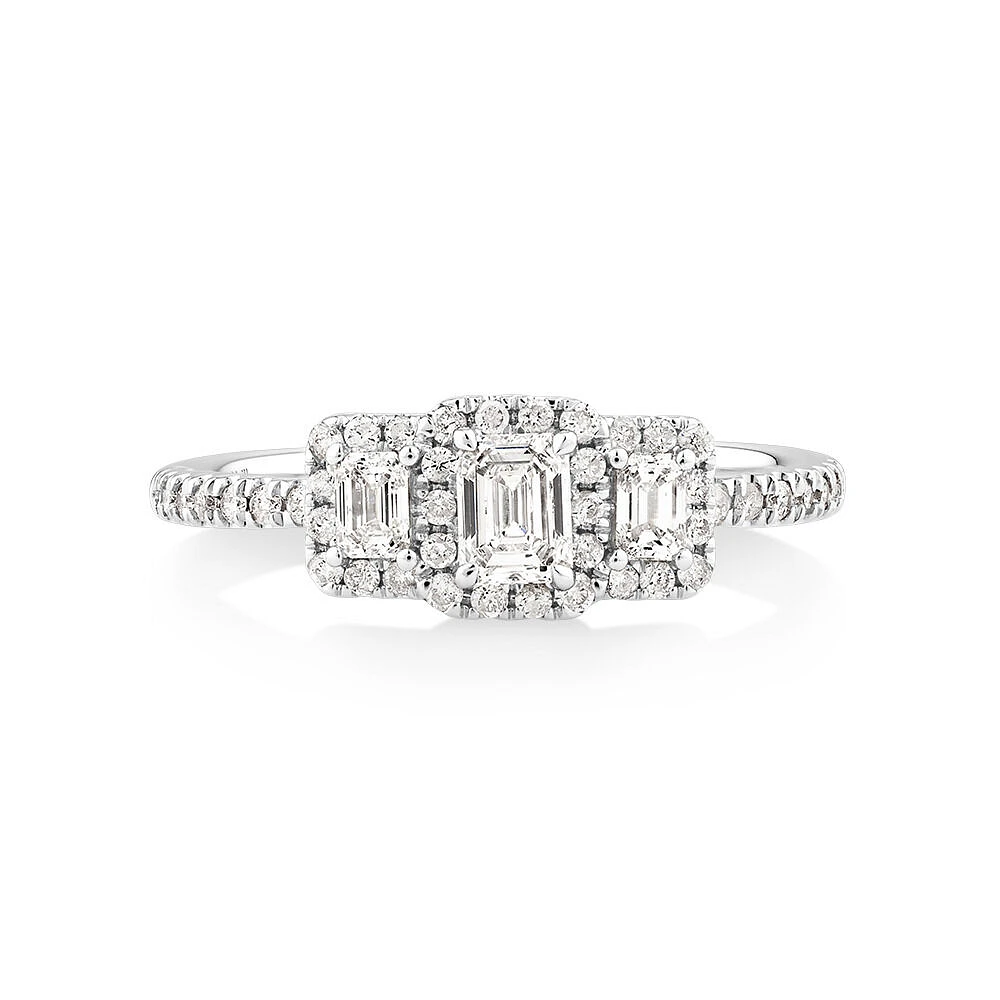 0.80 Carat TW Three Stone Emerald Cut Halo Engagement Ring in 14kt White Gold