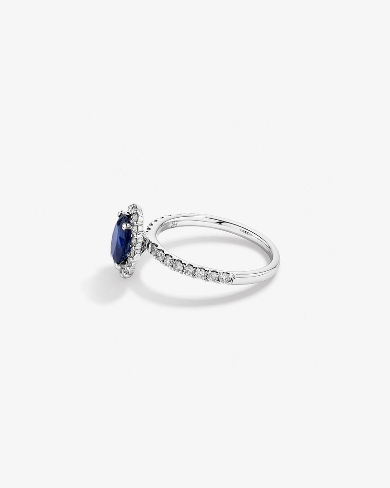 Oval Cut Blue Sapphire Gemstone and 0.60 Carat TW Diamond Halo Ring in 14kt White Gold