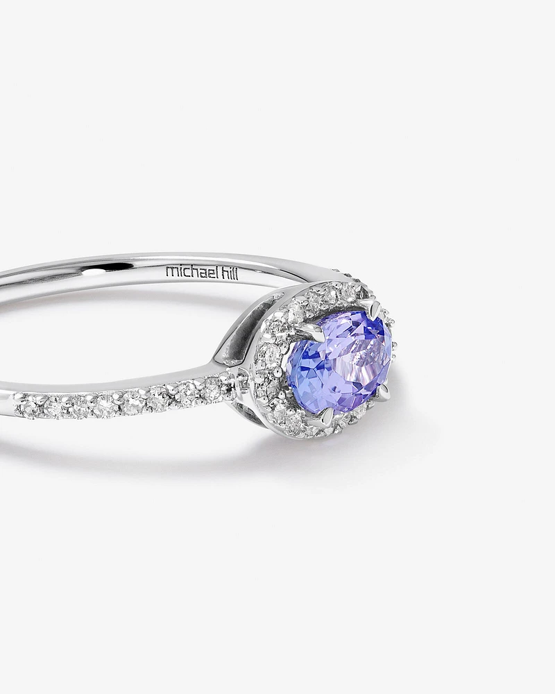 Halo Ring with Tanzanite & 0.15 Carat TW Of Diamonds in 10kt White Gold