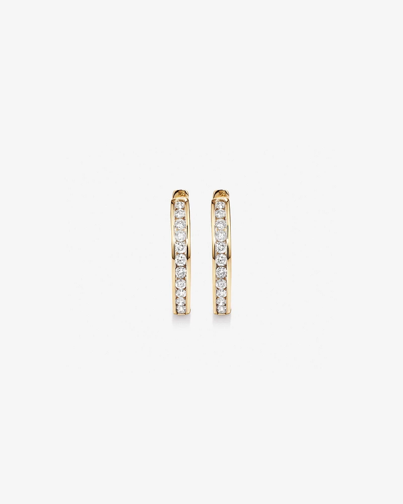 0.25 Carat TW Channel Set Round Brilliant Diamond Huggie Hoop Earrings in 10kt Yellow Gold