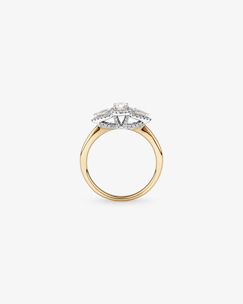0.69 Carat TW Three Stone Oval and Pear Cut Diamond Halo Engagement Ring in 14kt Yellow and White Gold