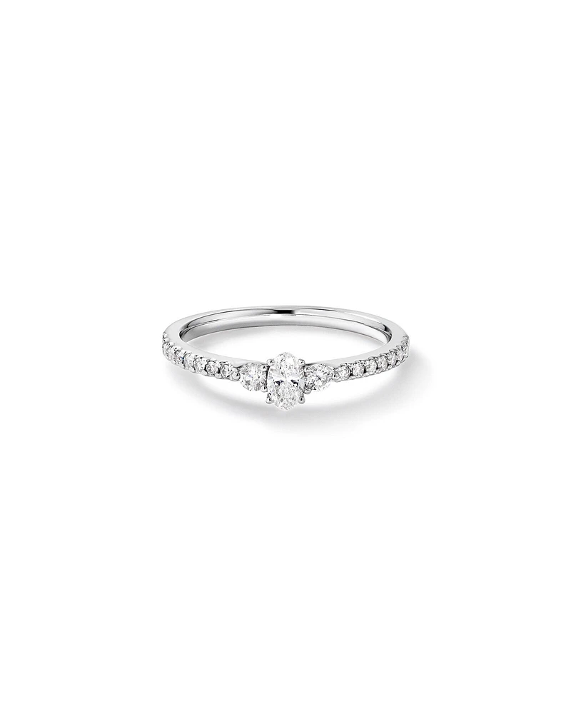 0.40 Carat TW Oval and Round Brilliant Three Stone Side Accent Engagement Ring in 14kt White Gold