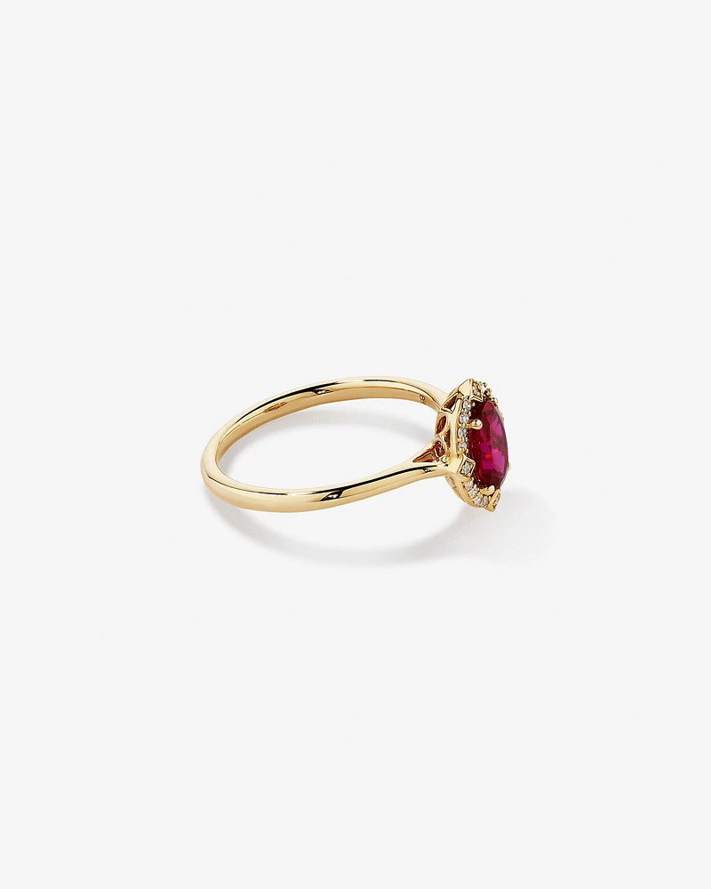 Oval Cut Created Ruby and Diamond Halo Ring in 10kt Yellow Gold