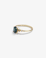 Ring with Blue Topaz and 0.12 Carat TW of Diamonds in 10kt Yellow Gold