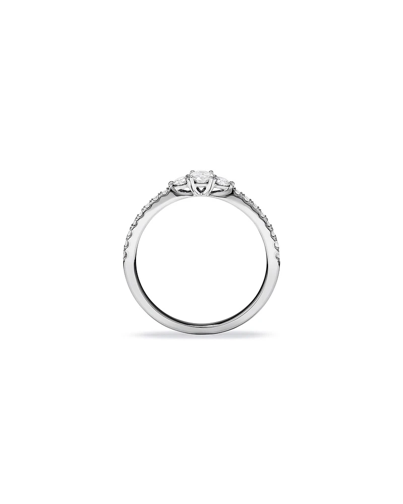 0.40 Carat TW Oval and Round Brilliant Three Stone Side Accent Engagement Ring in 14kt White Gold