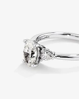 1.10 Carat TW Oval & Pear Cut Three Stone Engagement Ring in 18kt White Gold