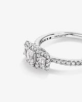 0.80 Carat TW Three Stone Emerald Cut Halo Engagement Ring in 14kt White Gold