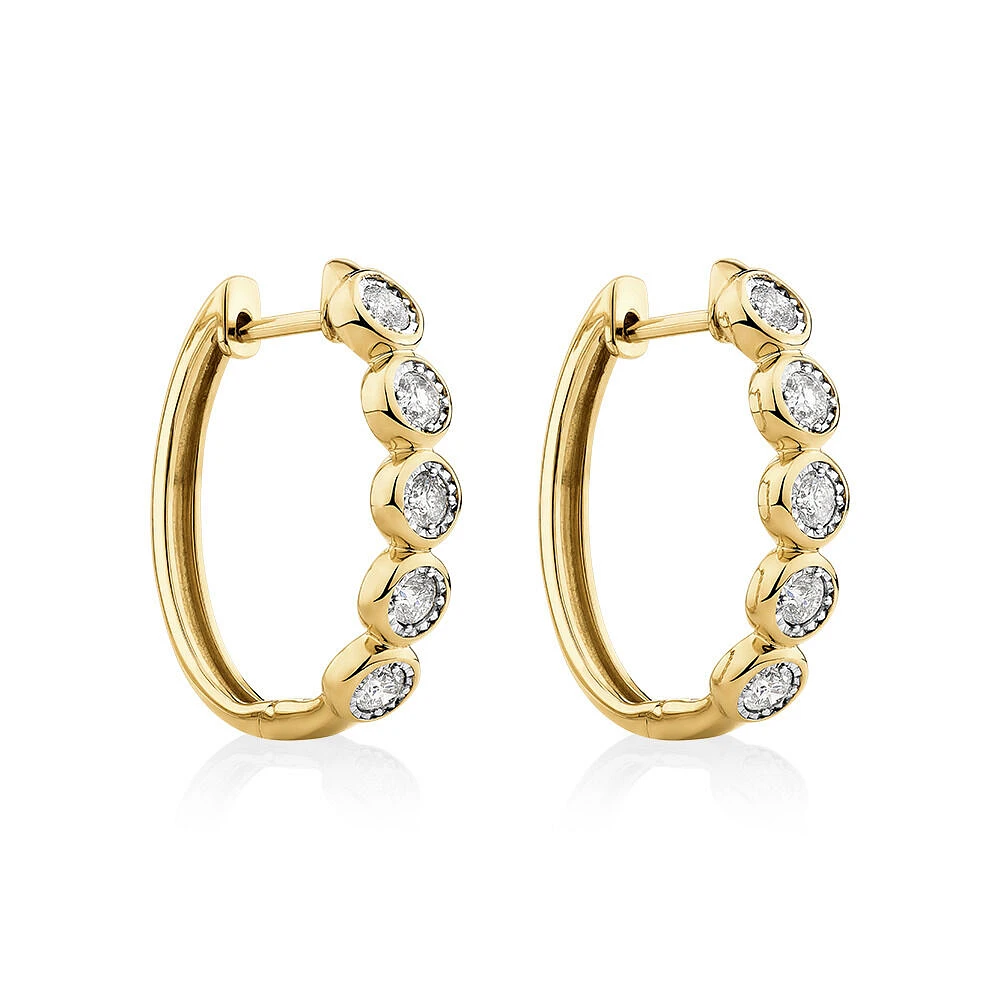 Huggie Earrings with 1/2 Carat TW of Diamonds in 10kt Yellow Gold